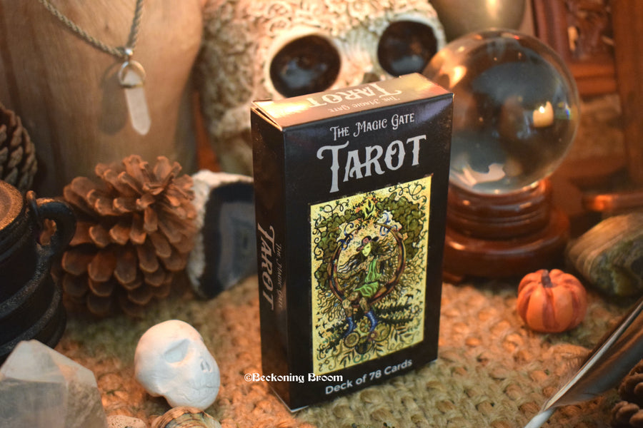 A deck of Magic Gate tarot cards sitting on an altar.