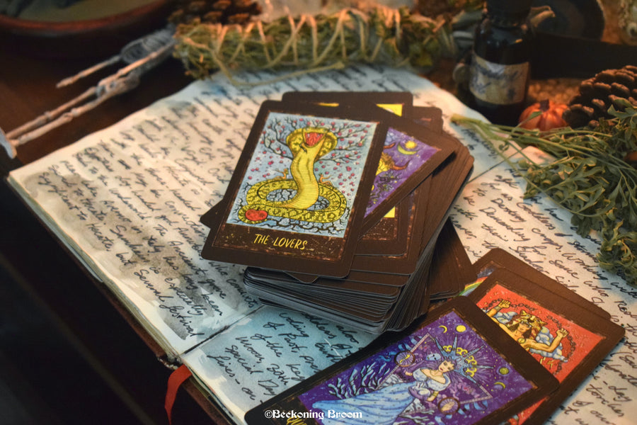 A deck of Magic Gate tarot cards sitting on an altar.