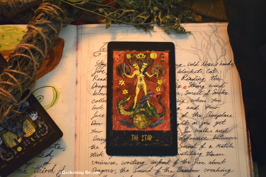 A tarot card sitting on an altar.