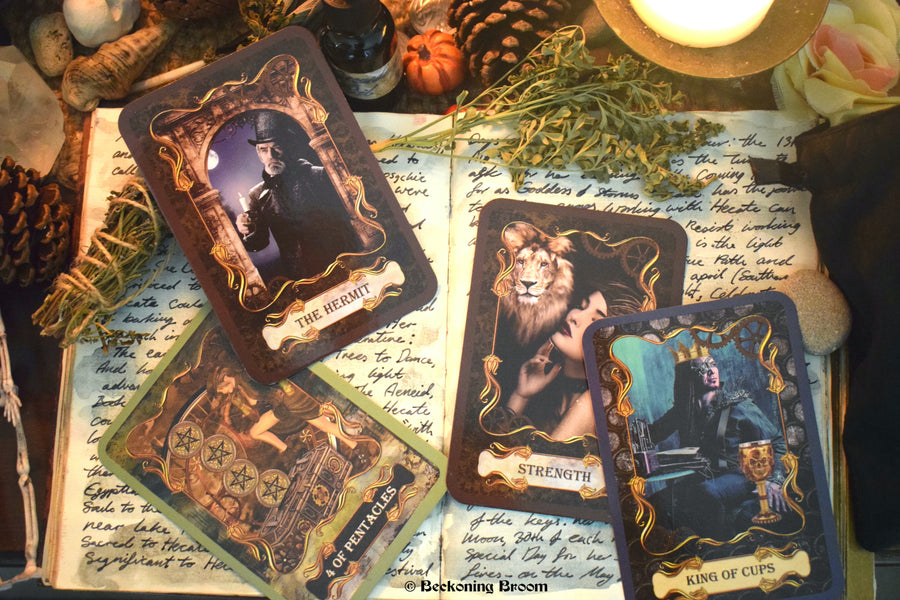 Four steampunk tarot cards laid out on an open grimoire with candles, herbs and other mysterious items surrounding.