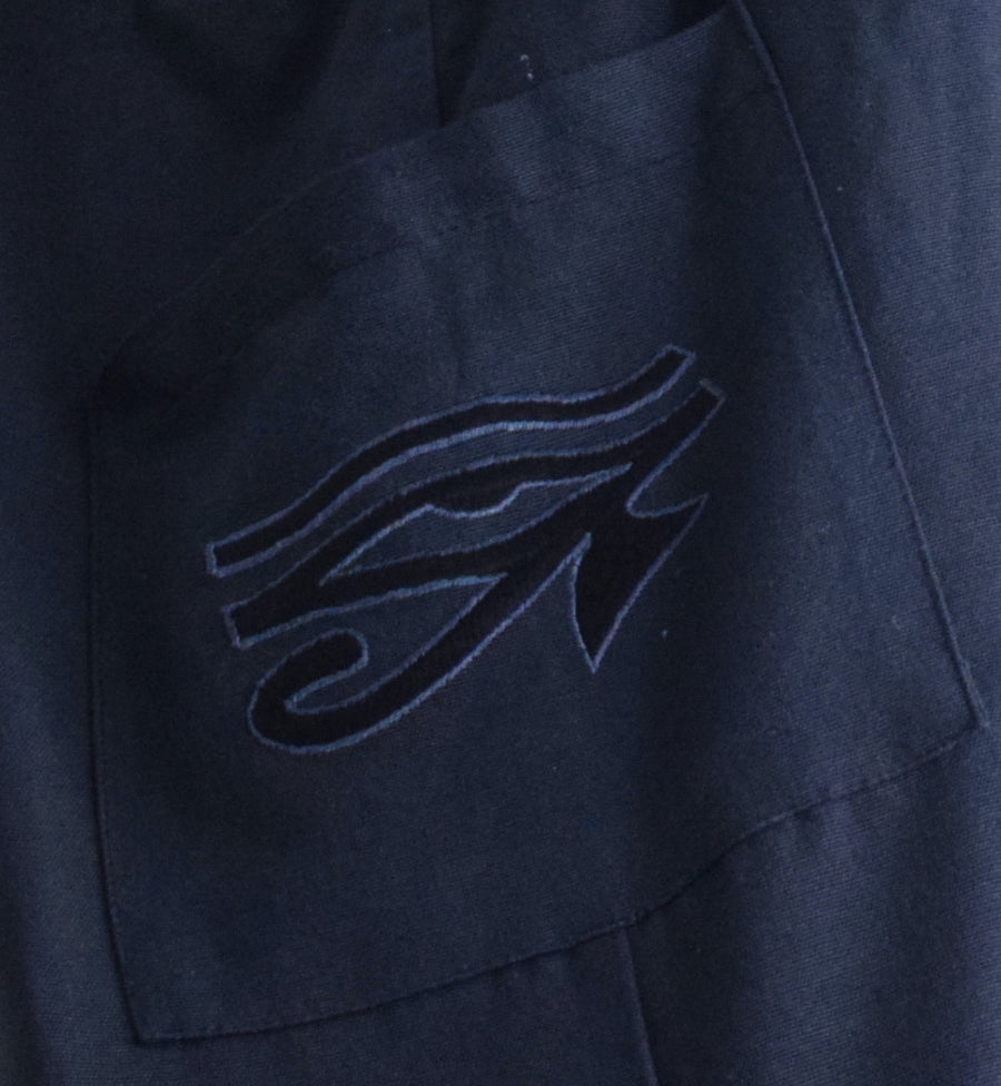 Eye of Horus embroidered on the front pocket of black bag