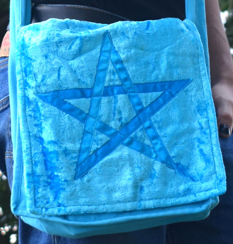 Light blue shoulder bag with pentagram on the front